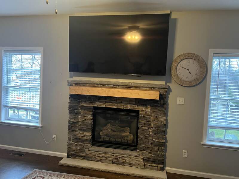 Television TV Mounting above fireplace.
